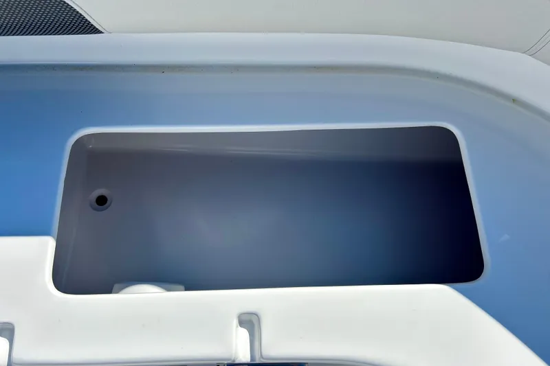 Slide: The Image of 2019 Hurricane SunDeck Sport 201 OB boat storage compartment, open and empty. - 25