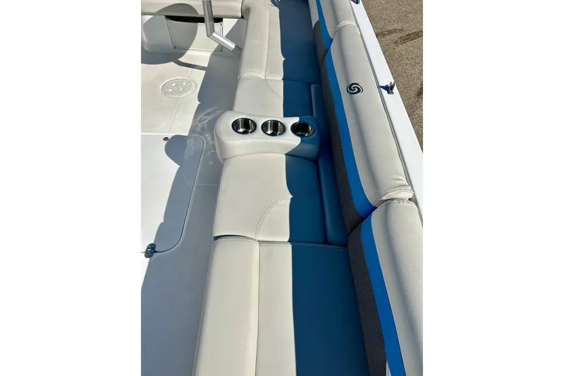 Slide: The Image of 2019 Hurricane SunDeck Sport 201 OB boat interior with cushioned seating and cup holders. - 26