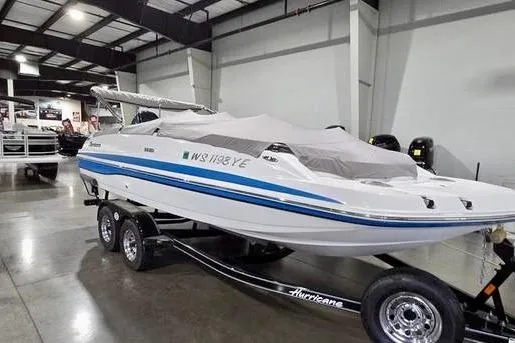 Slide: The Image of 2019 Hurricane SunDeck Sport 201 OB boat on trailer in indoor showroom. - 3