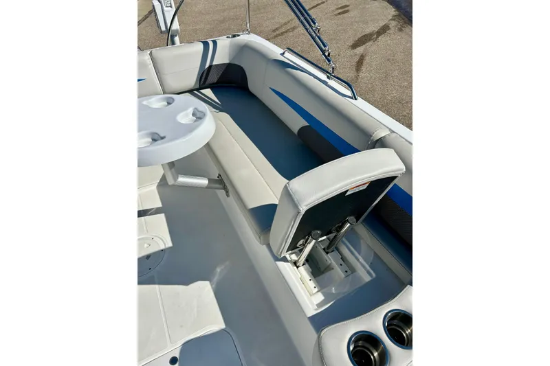 Slide: The Image of 2019 Hurricane SunDeck Sport 201 OB boat interior with seating and cup holders. - 30