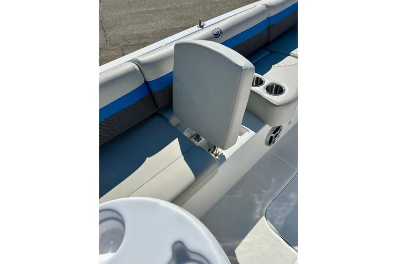 Slide: The Image of 2019 Hurricane SunDeck Sport 201 OB boat interior with seating and cup holders. - 31