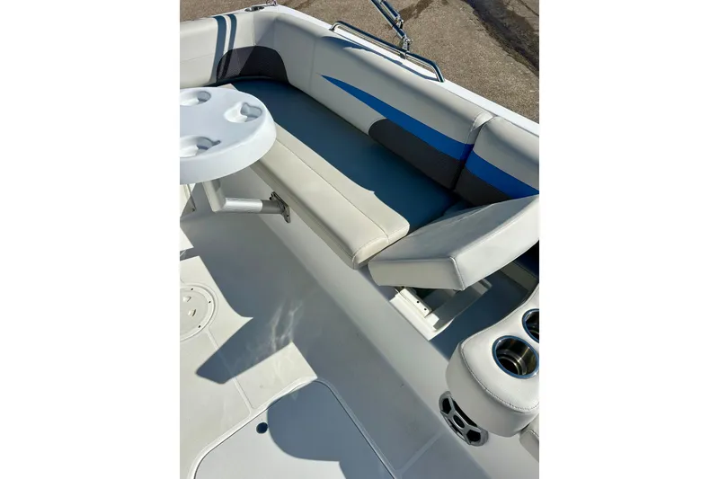 Slide: The Image of 2019 Hurricane SunDeck Sport 201 OB boat interior with seating and cup holders. - 32