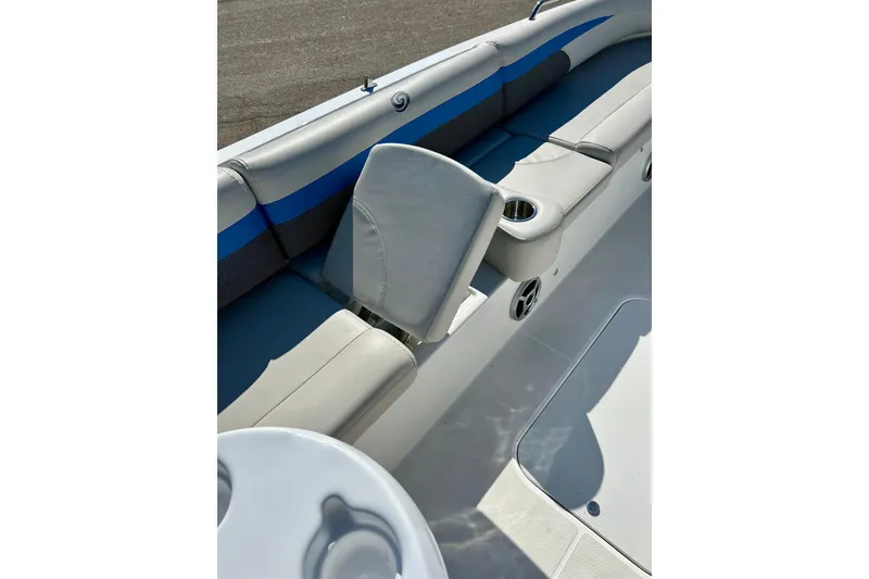 Slide: The Image of 2019 Hurricane SunDeck Sport 201 OB boat interior with cushioned seating and cup holders. - 33