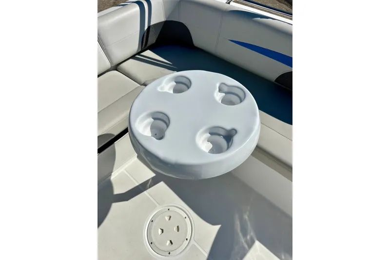 Slide: The Image of 2019 Hurricane SunDeck Sport 201 OB boat interior with cup holder table. - 34