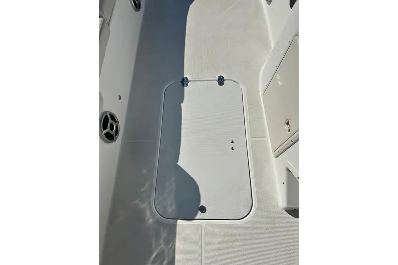 Slide: The Image of 2019 Hurricane SunDeck Sport 201 OB boat deck with storage hatch and speaker. - 36