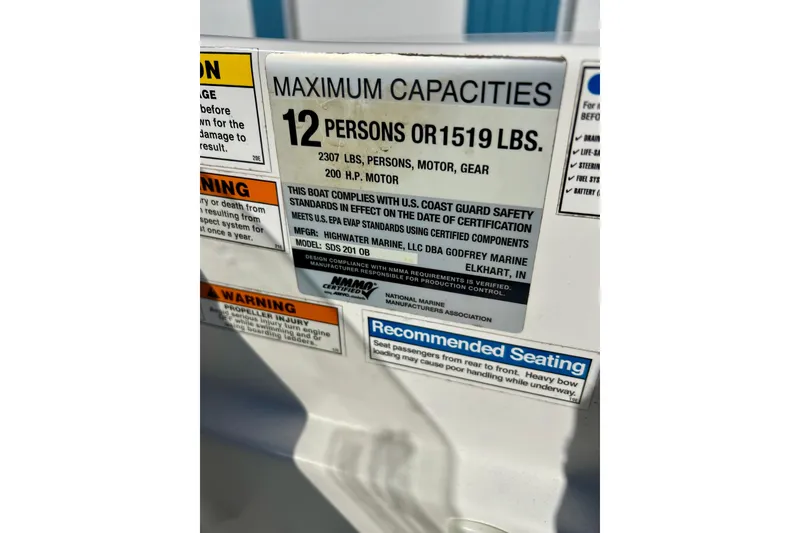 Slide: The Image of 2019 Hurricane SunDeck Sport 201 OB capacity label, maximum 12 persons or 1519 lbs. - 43