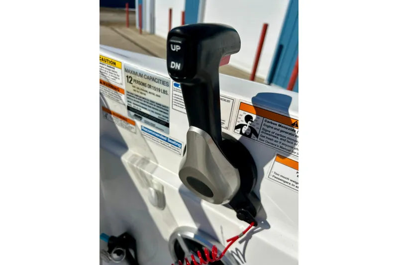 Slide: The Image of 2019 Hurricane SunDeck Sport 201 OB throttle control with safety warnings and capacity details. - 44