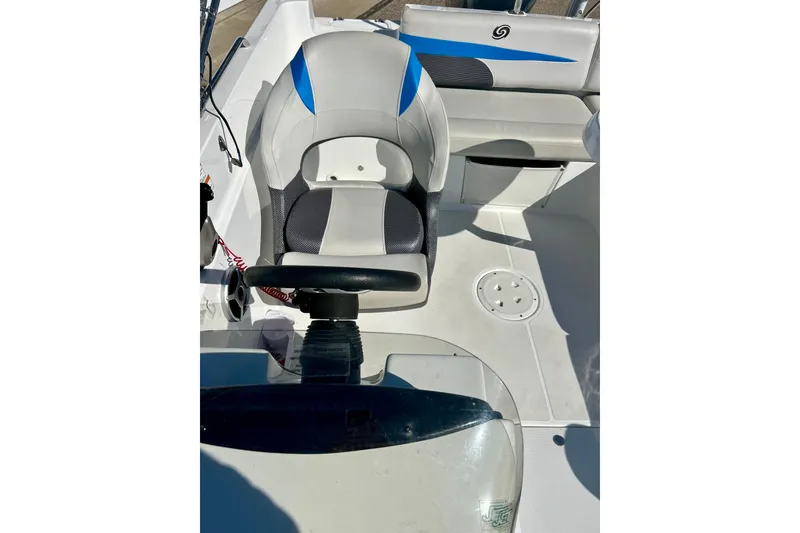 Slide: The Image of 2019 Hurricane SunDeck Sport 201 OB boat interior with steering wheel and seating. - 45