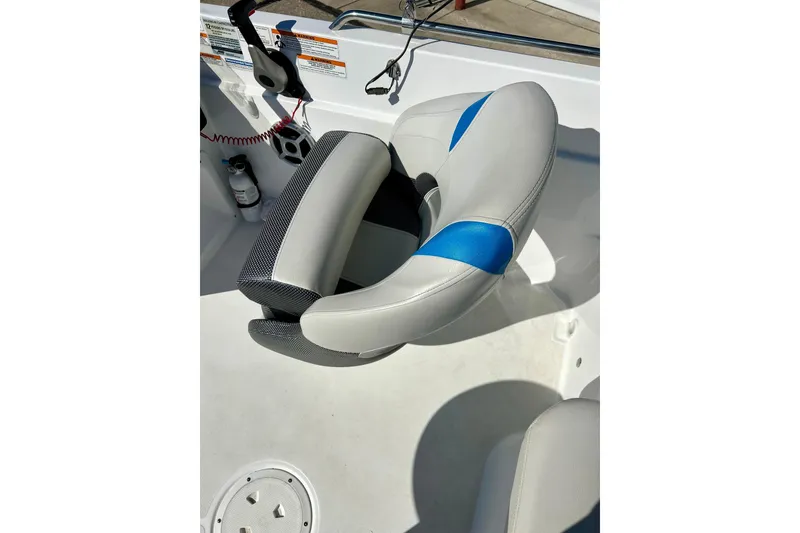 Slide: The Image of 2019 Hurricane SunDeck Sport 201 OB boat seat with blue accents and control panel. - 47