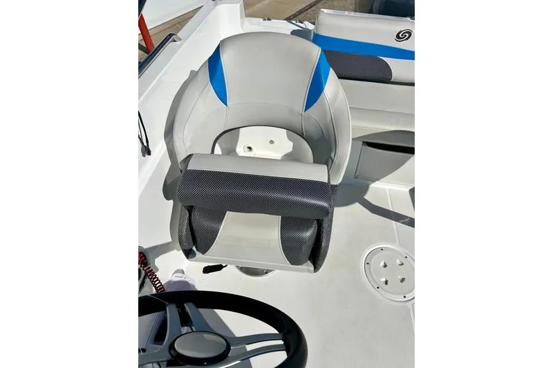 Slide: The Image of 2019 Hurricane SunDeck Sport 201 OB boat interior with steering wheel and seating. - 48