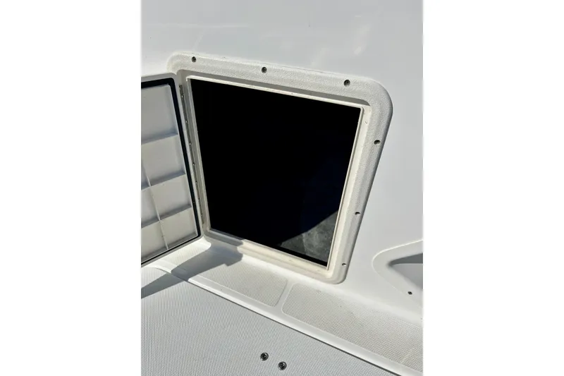 Slide: The Image of Open storage compartment on 2019 Hurricane SunDeck Sport 201 OB boat. - 50
