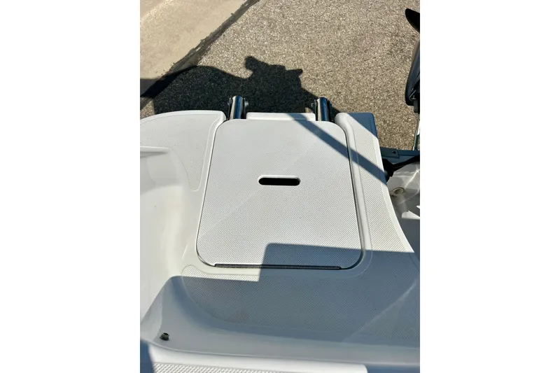Slide: The Image of 2019 Hurricane SunDeck Sport 201 OB boat deck with storage compartment. - 51