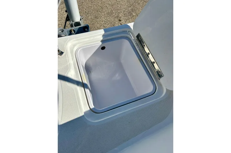 Slide: The Image of Open storage compartment on 2019 Hurricane SunDeck Sport 201 OB boat. - 53