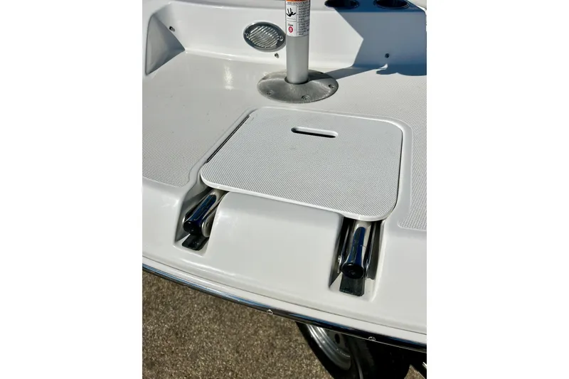 Slide: The Image of 2019 Hurricane SunDeck Sport 201 OB boat deck with storage compartment and cup holders. - 55
