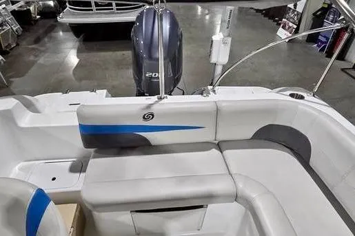 Slide: The Image of 2019 Hurricane SunDeck Sport 201 OB boat interior with seating and motor. - 9