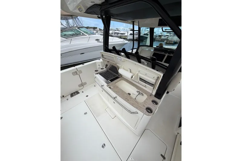 Slide: The Image of 2022 Boston Whaler 380 Outrage interior with sleek design and modern amenities. - 4