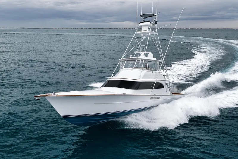 The Image of 1997 Merritt 58 yacht cruising on open sea under cloudy skies. - 0