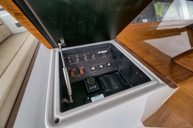 Slide: The Image of Control panel on a 1997 Merritt 58 yacht with wooden finish. - 110
