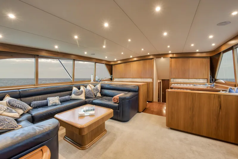 Slide: The Image of Luxurious interior of 1997 Merritt 58 yacht with elegant wood finishes and plush seating. - 119