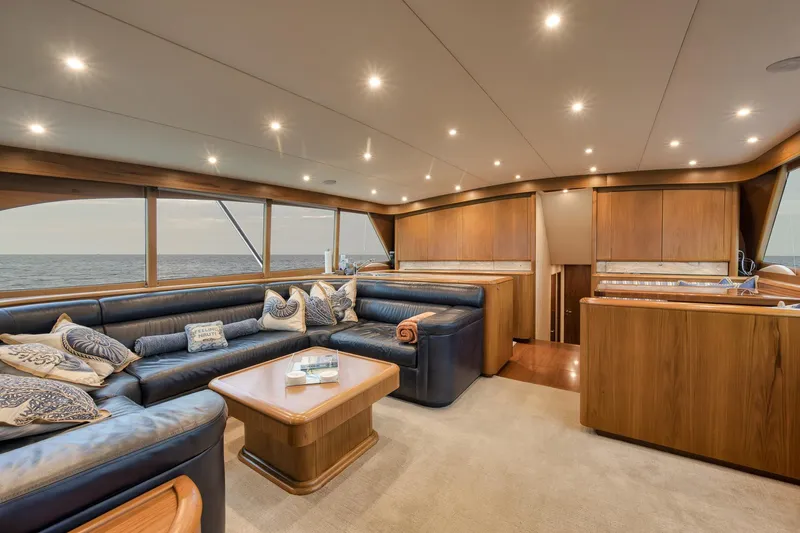 Slide: The Image of Luxurious interior of 1997 Merritt 58 yacht with plush seating and ocean view. - 120