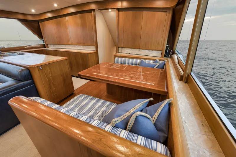 Slide: The Image of Luxurious 1997 Merritt 58 yacht interior with elegant wood finish and ocean view. - 123