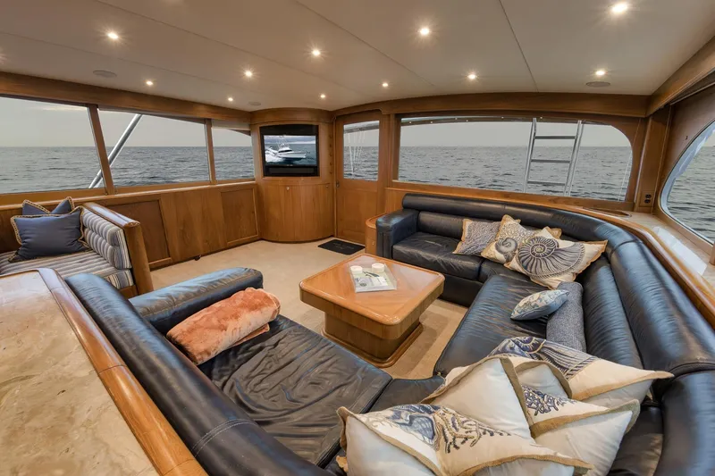 Slide: The Image of Luxurious Merritt 58 yacht interior, 1997 model, featuring elegant seating and ocean view. - 124