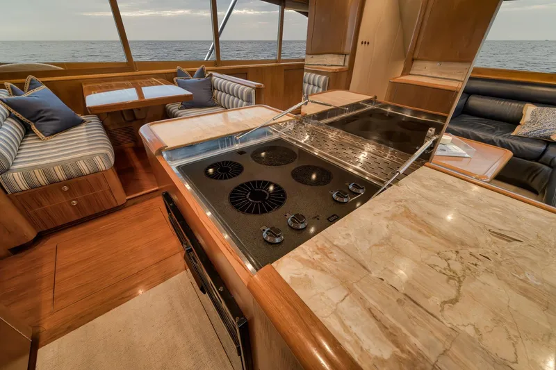 Slide: The Image of Luxurious Merritt 58 yacht interior with modern kitchen and ocean view, 1997 model. - 125