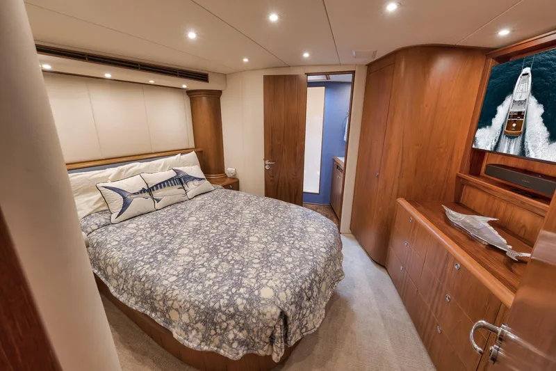 Slide: The Image of Luxurious cabin interior of a 1997 Merritt 58 yacht with elegant wood finishes. - 137