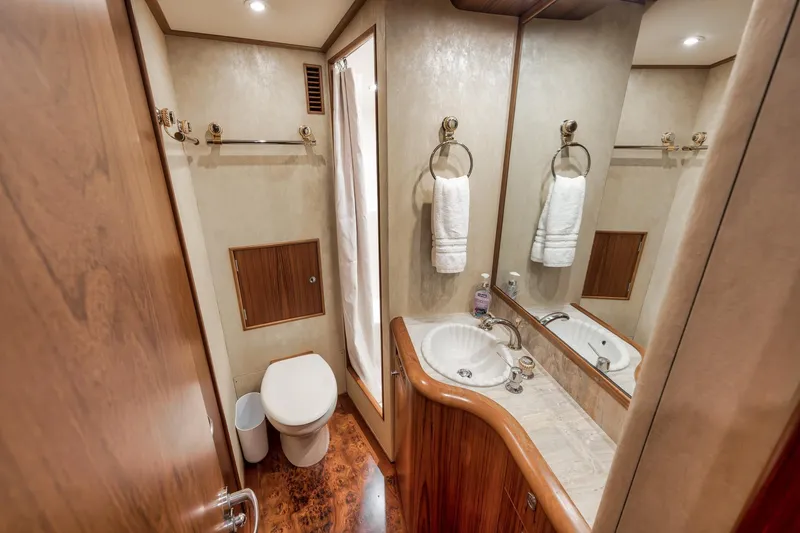 Slide: The Image of Luxurious bathroom in 1997 Merritt 58 yacht with elegant wood finishes and modern amenities. - 149