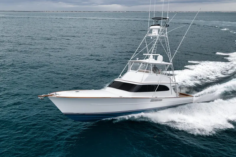 Slide: The Image of 1997 Merritt 58 yacht cruising on open ocean waters. - 15