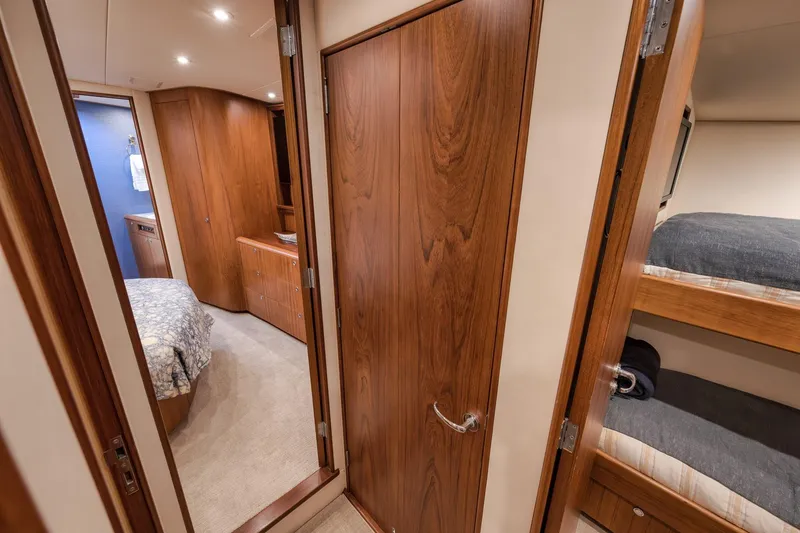 Slide: The Image of Luxurious interior of 1997 Merritt 58 yacht with wood finishes and cozy sleeping quarters. - 152