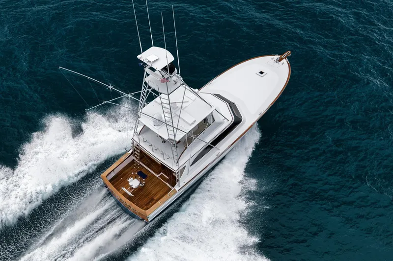 Slide: The Image of Aerial view of 1997 Merritt 58 yacht cruising on open ocean waters. - 19