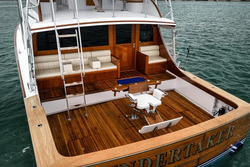 Slide: The Image of Luxurious 1997 Merritt 58 yacht with teak deck and fishing chair on open sea. - 30