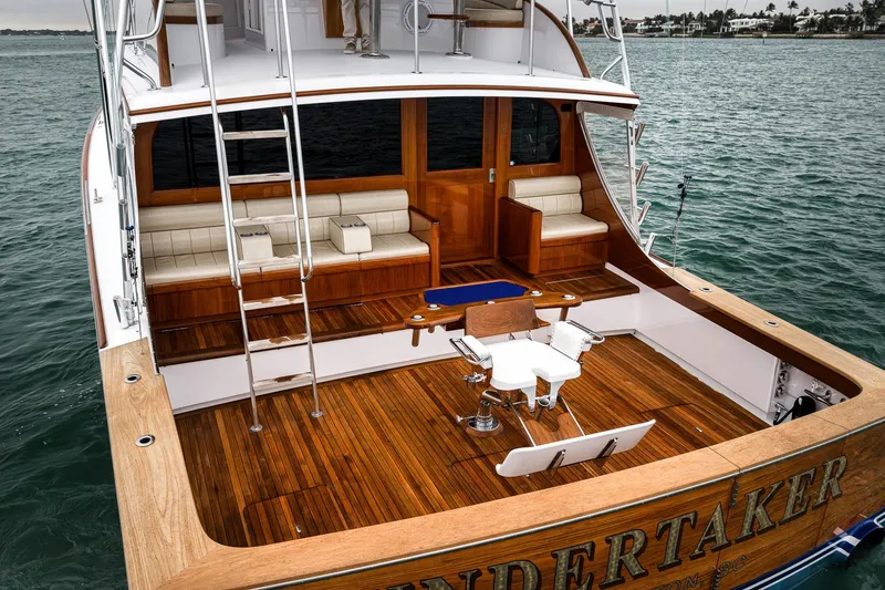 Slide: The Image of Luxurious 1997 Merritt 58 yacht with teak deck and comfortable seating on open water. - 31