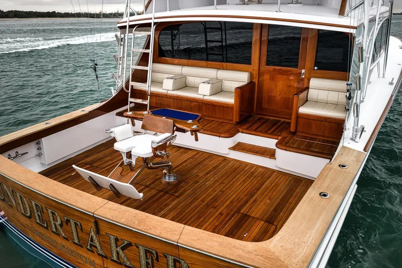 Slide: The Image of Luxurious 1997 Merritt 58 yacht with teak deck and comfortable seating. - 32
