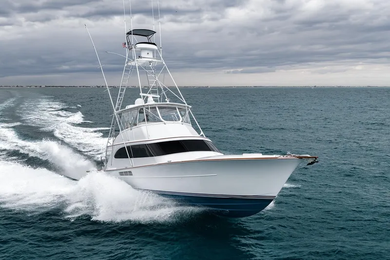 Slide: The Image of Merritt 58 yacht cruising on open sea under cloudy skies, 1997 model. - 5