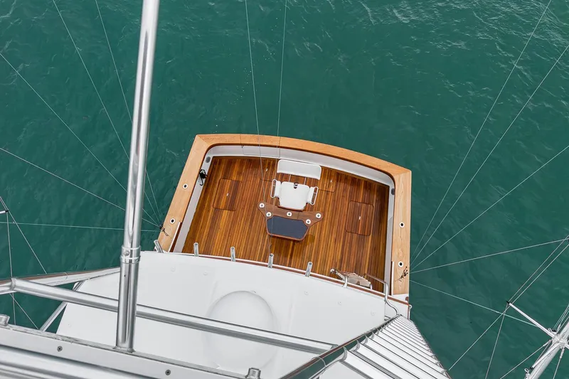 Slide: The Image of Aerial view of 1997 Merritt 58 yacht deck over turquoise water. - 52