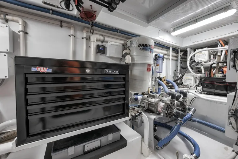 Slide: The Image of Engine room of 1997 Merritt 58 yacht with tool chest and mechanical equipment. - 61