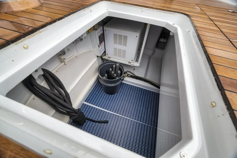 Slide: The Image of Open storage compartment on 1997 Merritt 58 yacht with ropes and equipment. - 78