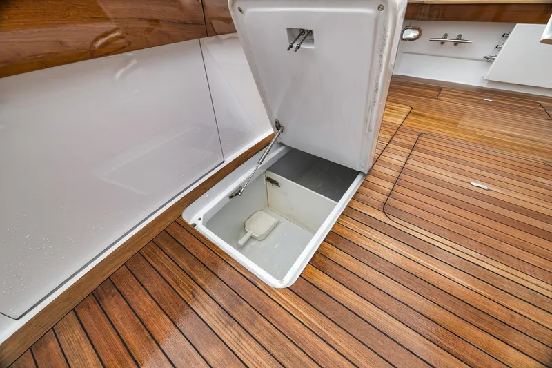 Slide: The Image of Open hatch on Merritt 58 yacht, showcasing teak deck, 1997 model. - 79
