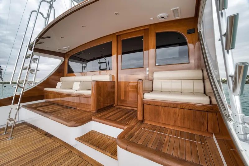 Slide: The Image of Luxurious 1997 Merritt 58 yacht with elegant wooden deck and comfortable seating. - 92