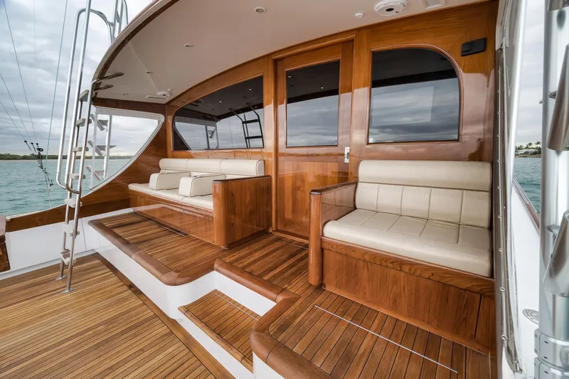 Slide: The Image of Luxurious 1997 Merritt 58 yacht with elegant wooden deck and comfortable seating. - 93