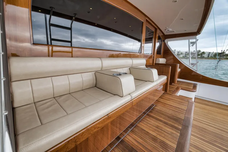 Slide: The Image of Luxurious seating area on a 1997 Merritt 58 yacht with wooden deck and ocean view. - 94