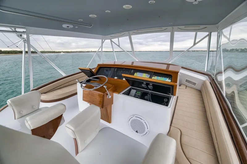 Slide: The Image of Luxurious 1997 Merritt 58 yacht helm with leather seating and panoramic ocean view. - 101