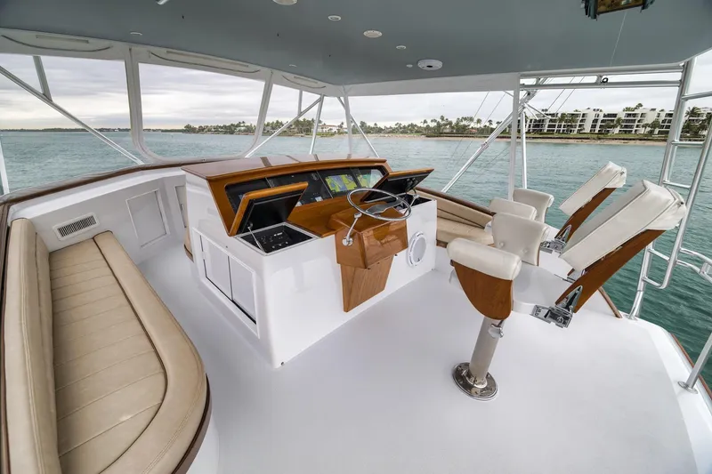 Slide: The Image of Luxurious 1997 Merritt 58 yacht helm with leather seating and ocean view. - 105
