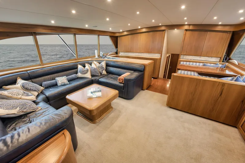Slide: The Image of Luxurious Merritt 58 yacht interior, 1997 model, featuring elegant wood finishes and plush seating. - 118