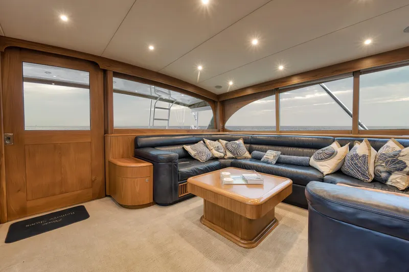 Slide: The Image of Luxurious Merritt 58 yacht interior, 1997 model, featuring plush seating and elegant wooden accents. - 122