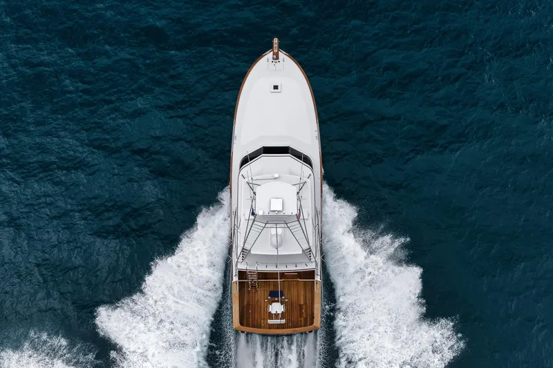 Slide: The Image of Aerial view of 1997 Merritt 58 yacht cruising through deep blue ocean waters. - 29