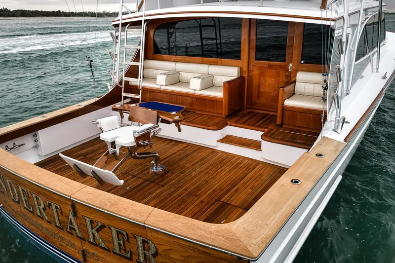 Slide: The Image of Luxurious 1997 Merritt 58 yacht with elegant wooden deck and comfortable seating. - 33