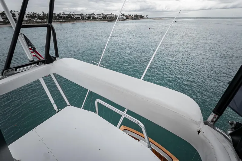 Slide: The Image of View from Merritt 58 yacht, 1997 model, overlooking calm ocean waters and distant shoreline. - 51
